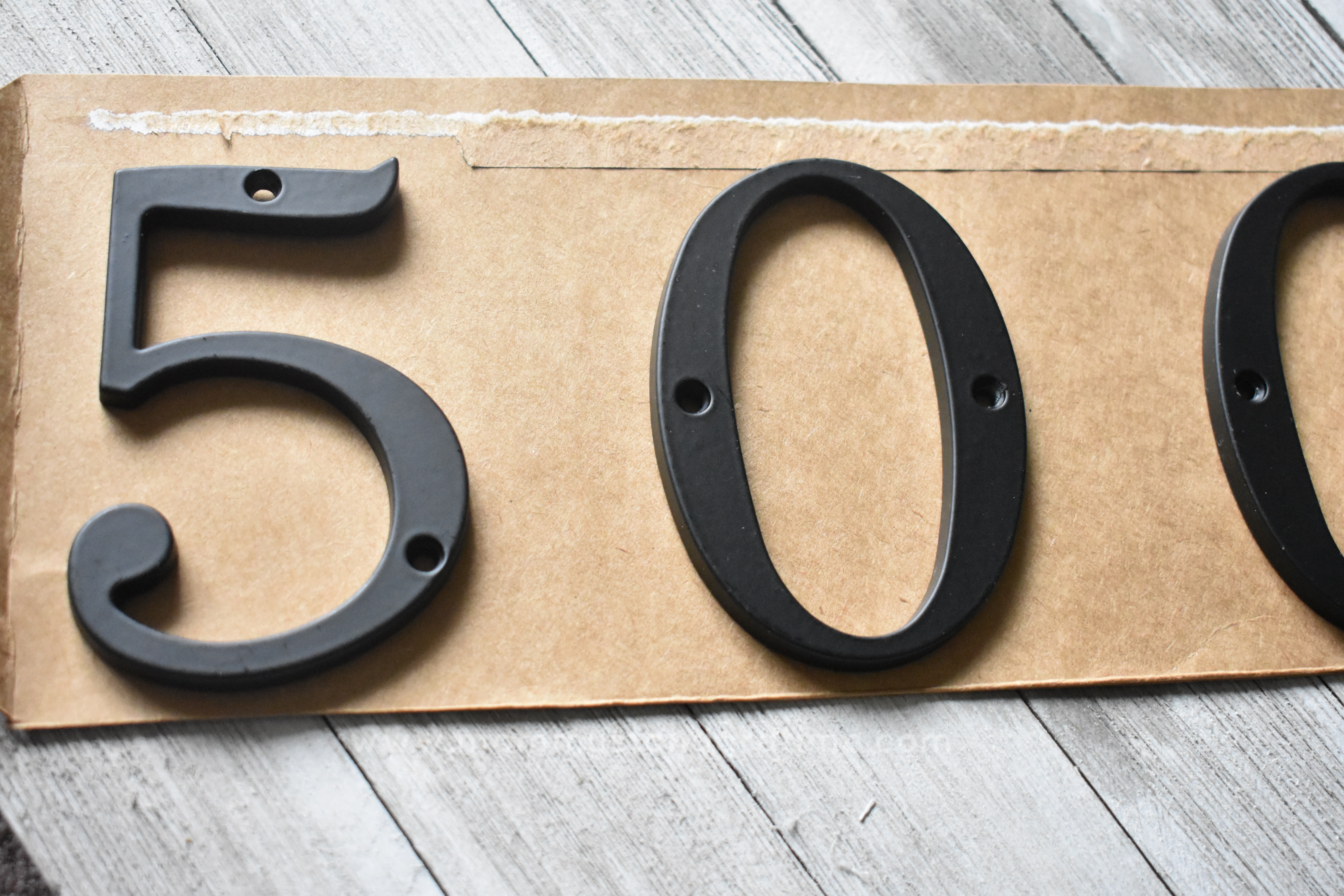 Lining up house numbers to hang Mommy Standard Time