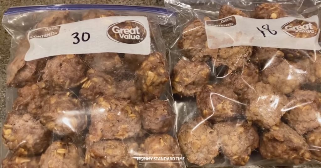 Two bags of cooked meatballs with the number of meatballs written on each bag
